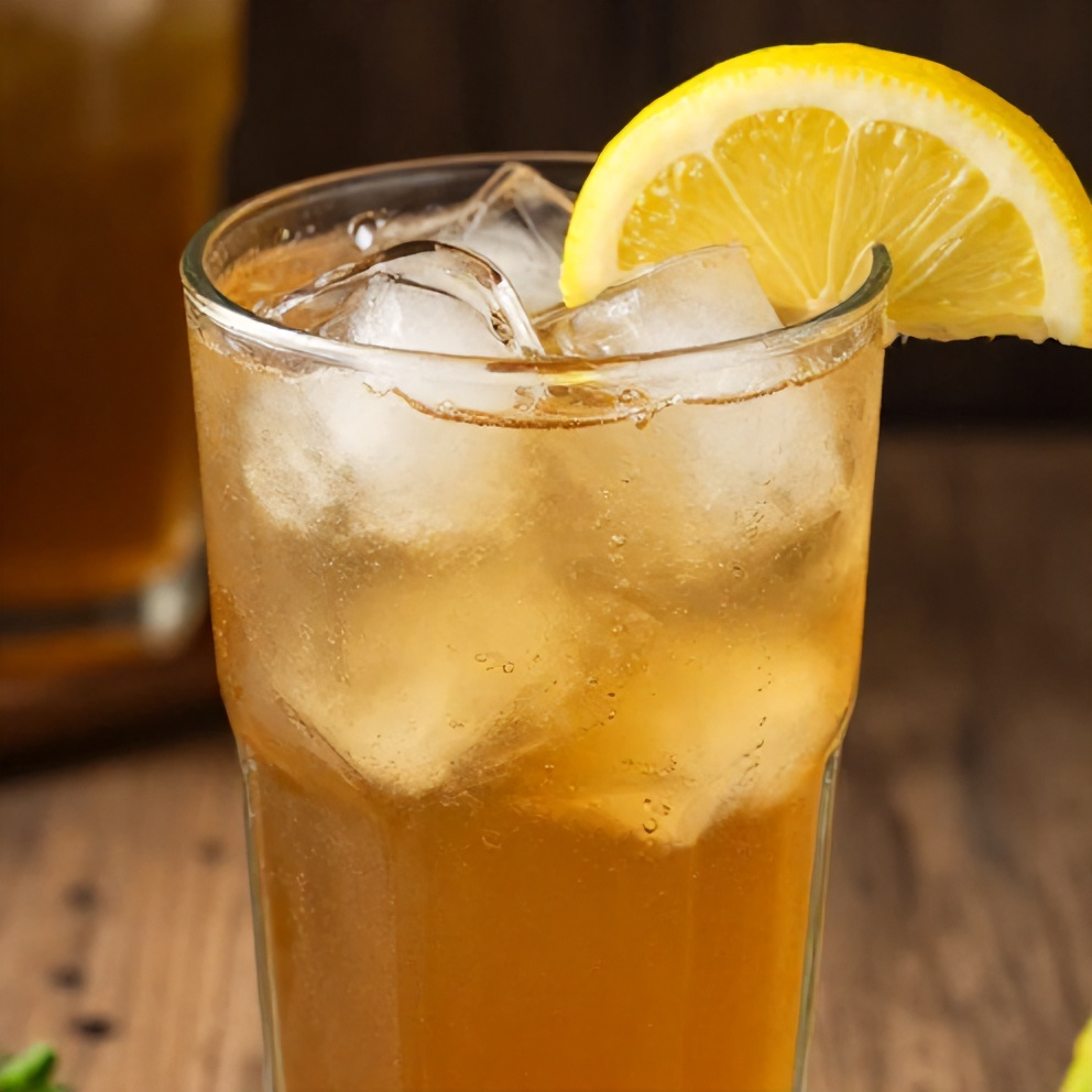 Glass of Crispy Mint Lemon Verbena Iced Tea with lemon slice