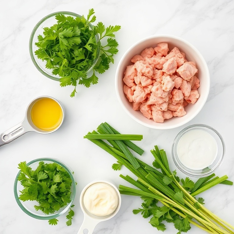 Raw ingredients for green goddess turkey burgers. Ground turkey, fresh parsley, green onions, mayonnaise, and lemon juice. Measuring spoons and bowls on white marble surface.