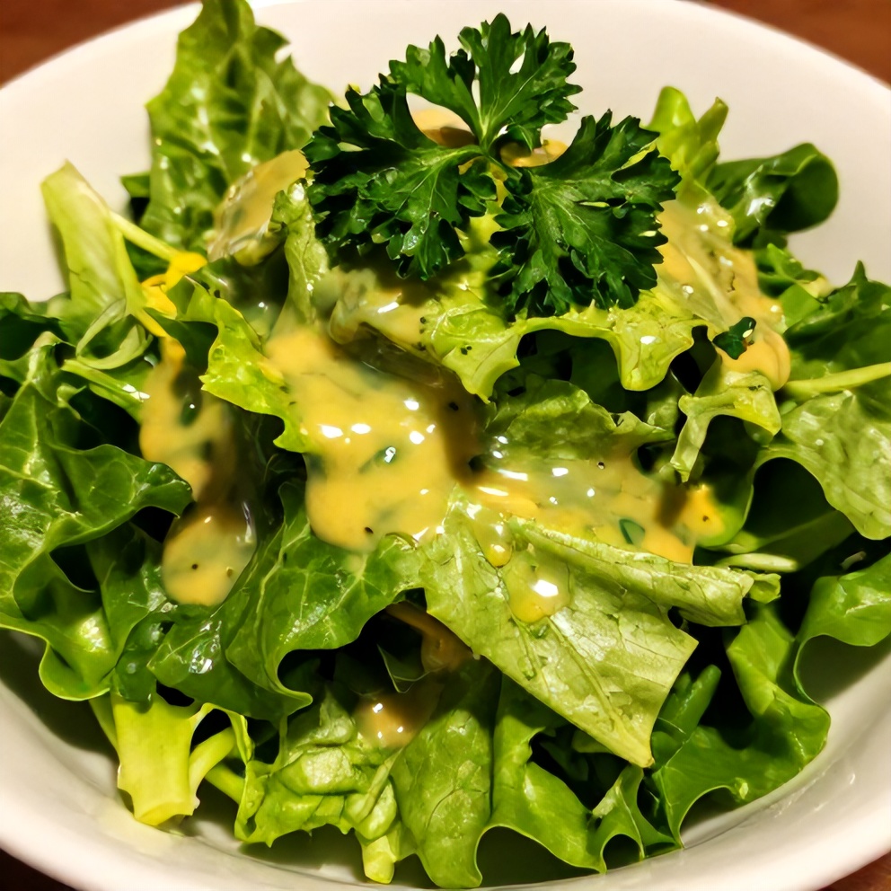 Fresh salad greens tossed with lemon vinaigrette and served in a bowl