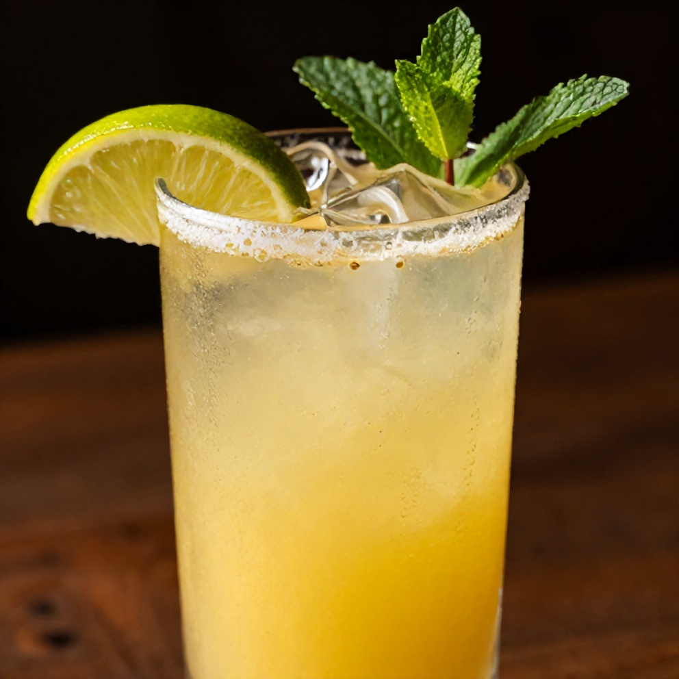 Pineapple Margarita Mocktail in a Glass with Lime Wedge